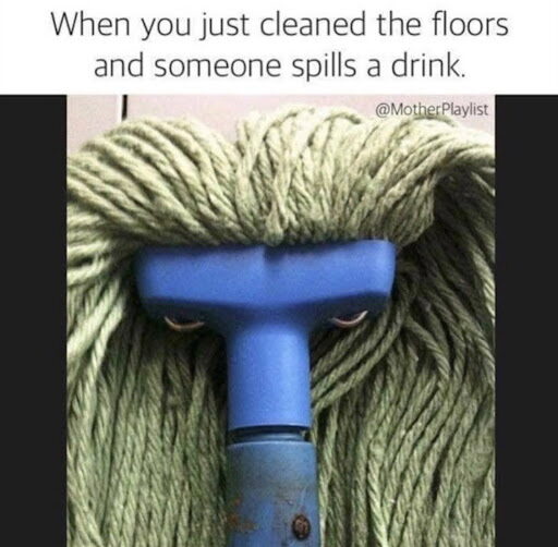 An mop, where the strands appear like hair and rivets appear as eyes, looks to have a scowl on its face